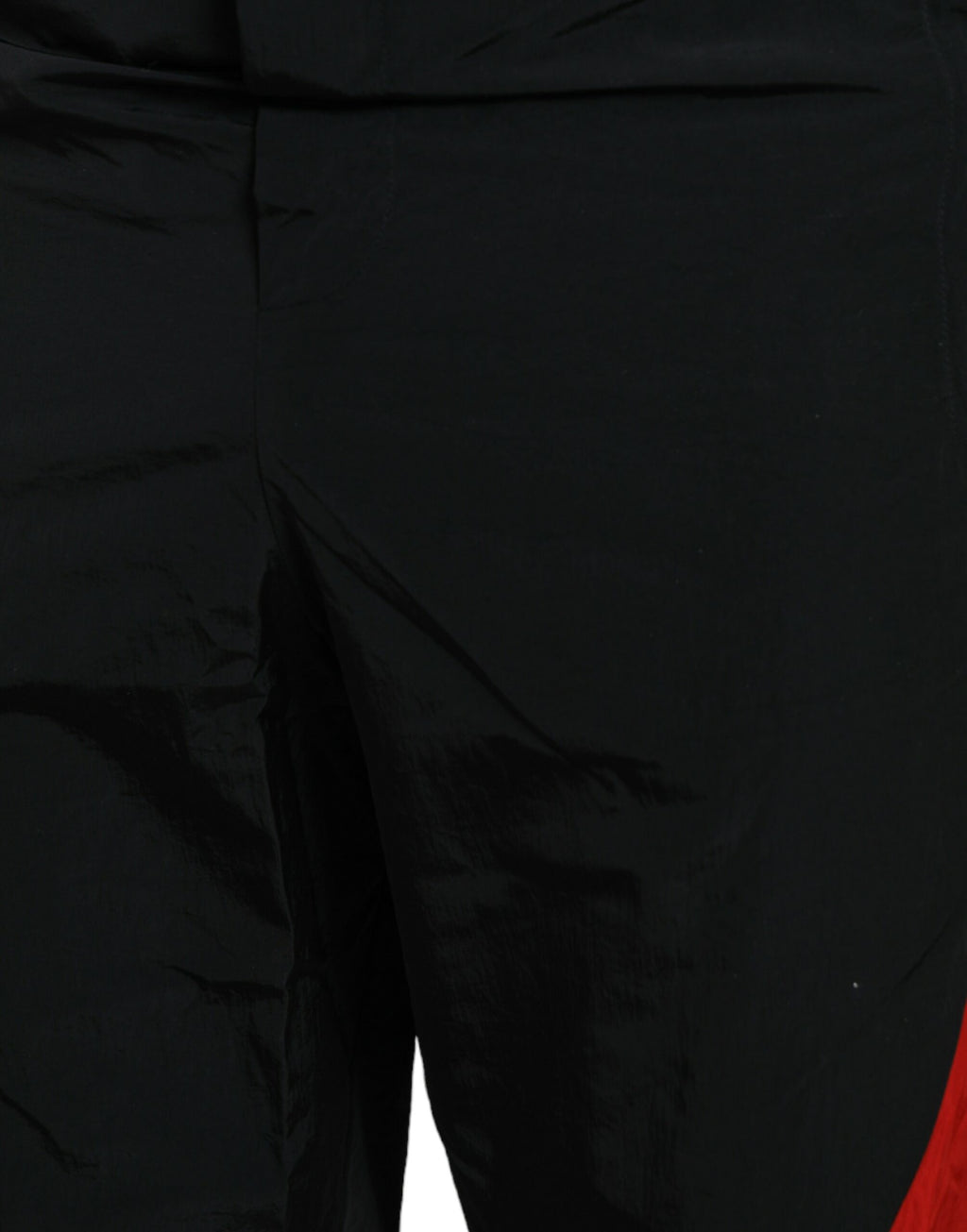 Pantalons joggers en nylon Dolce & Gabbana à imprimé léopard rouge et noir, style décontracté et tendance.