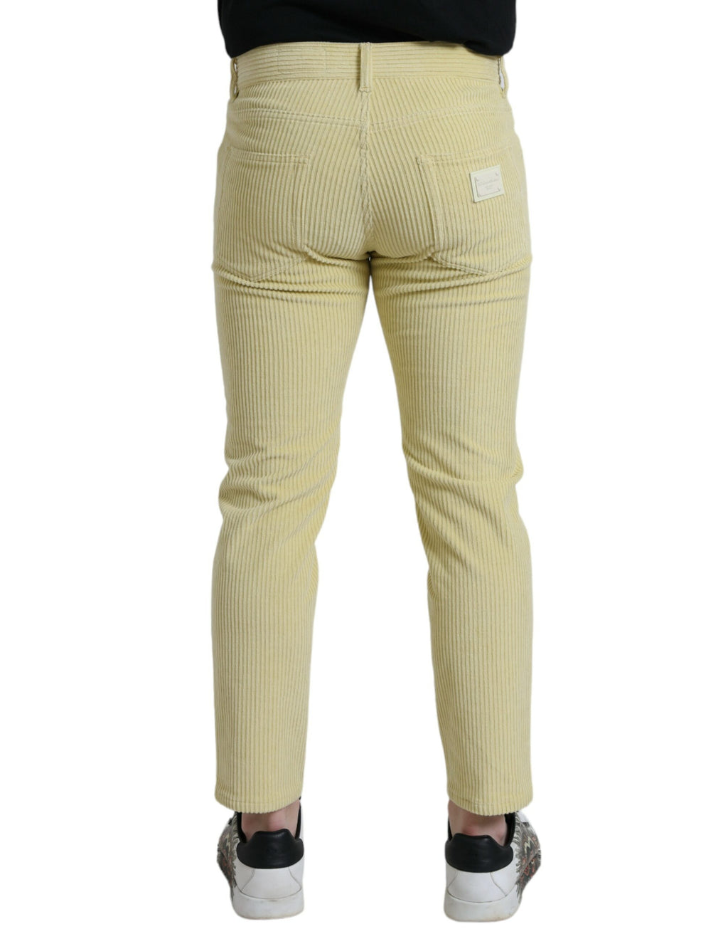 Jeans en denim skinny jaune Dolce & Gabbana avec logo en plaque de velours côtelé, détails modernes et élégants