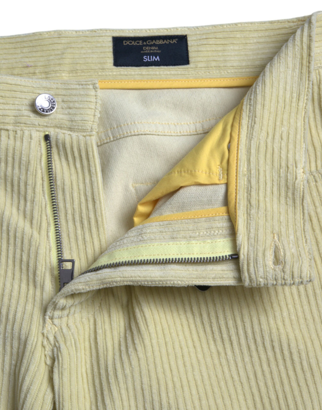 Jeans skinny en denim jaune Dolce & Gabbana avec logo en plaque en corduroy, style moderne et tendance.