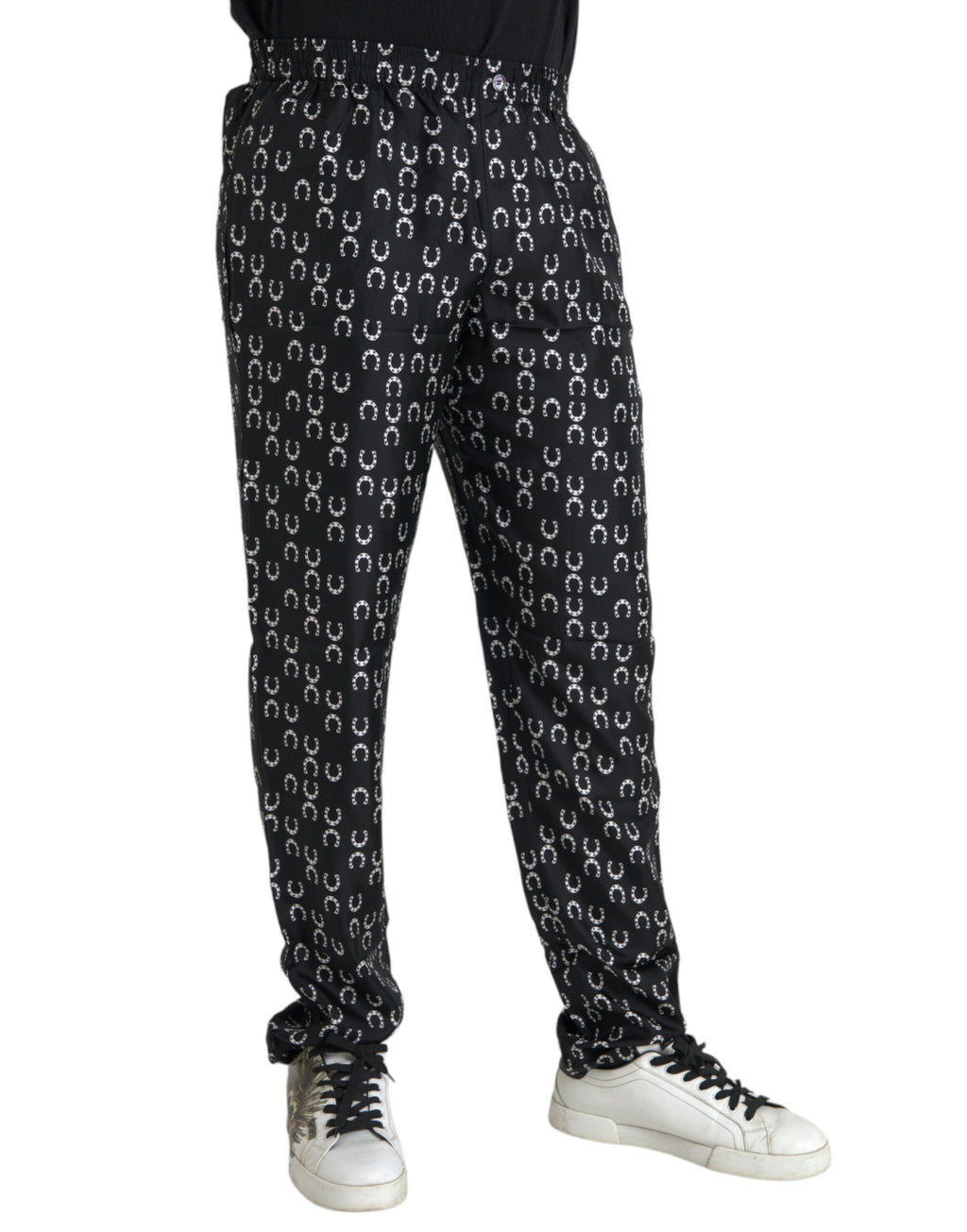 Pantalons en soie noirs Dolce & Gabbana avec motif fer à cheval, style élégant et sophistiqué.