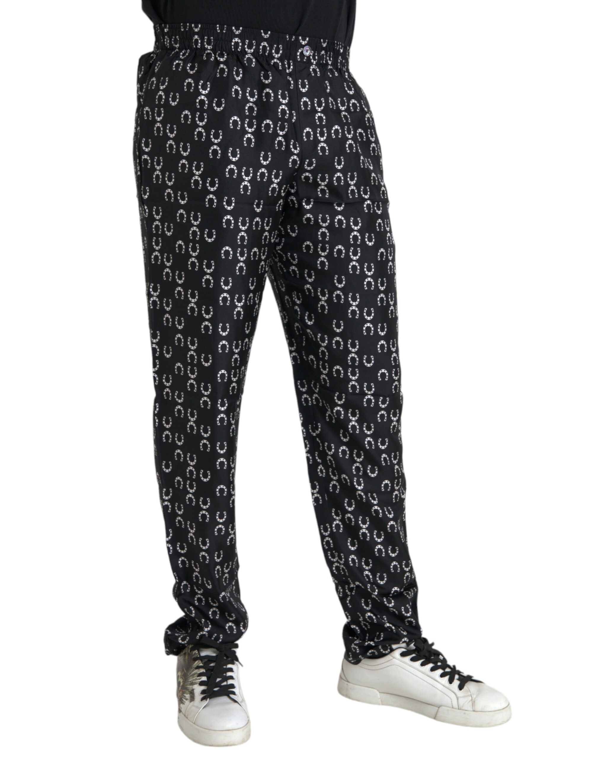 Pantalons en soie noirs Dolce & Gabbana avec motif fer à cheval, style élégant et sophistiqué.
