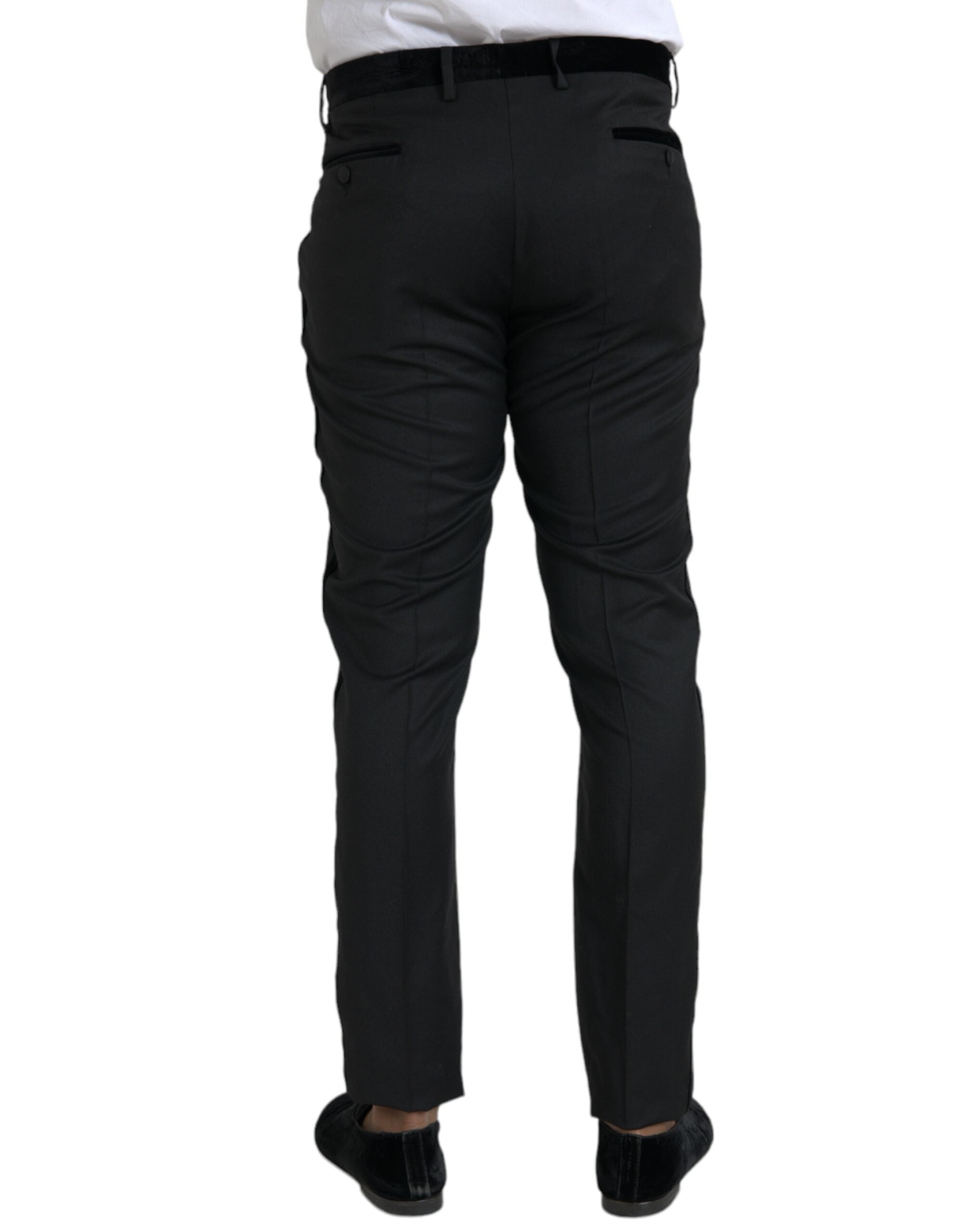 Pantalon homme skinny en soie noire de Dolce & Gabbana, style élégant et ajusté, visible en détail sur l'image.