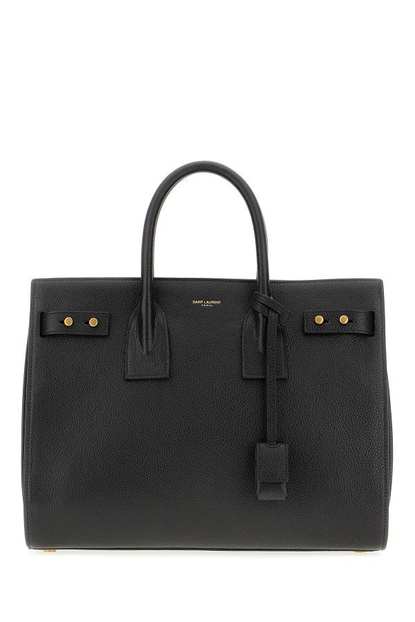 Sac à main Saint Laurent Sac De Jour en cuir de veau noir, élégant avec poignées et détails sophistiqués.