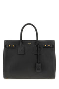 Sac à main Saint Laurent Sac De Jour en cuir de veau noir, élégant avec poignées et détails sophistiqués.