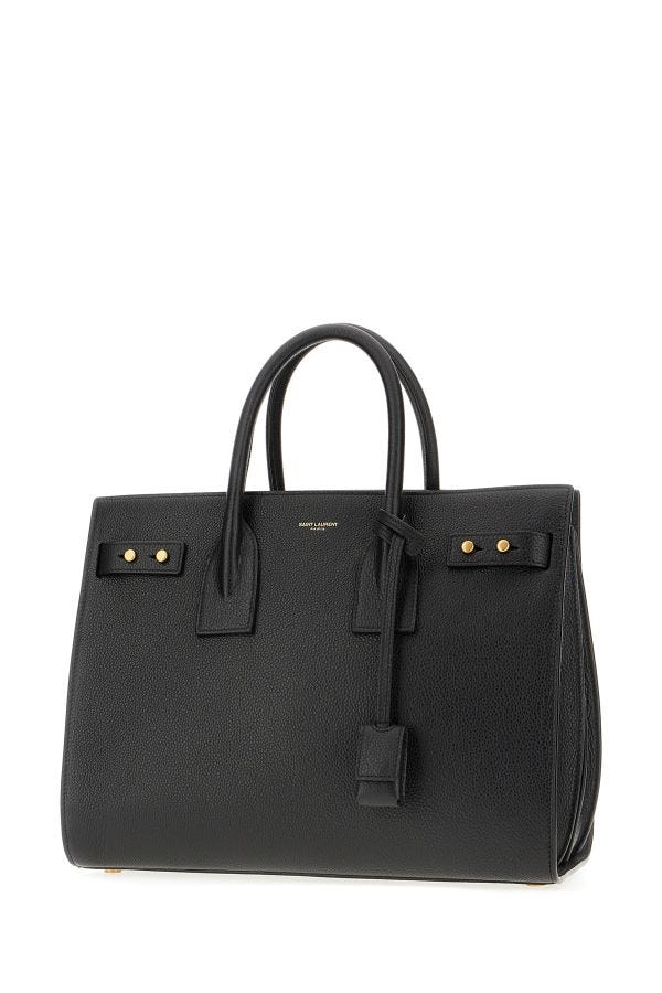 Sac à main Saint Laurent Sac De Jour en cuir de veau noir, élégant et sophistiqué, avec détails en métal et poignée en cuir.
