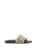 Sandales en caoutchouc marron Burberry, chaussures de plage ou décontractées, avec logo Burberry visible.