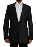 Manteau blazer noir en laine Dolce & Gabbana à col cranté et boutonnage simple, élégance classique et sophistiquée.