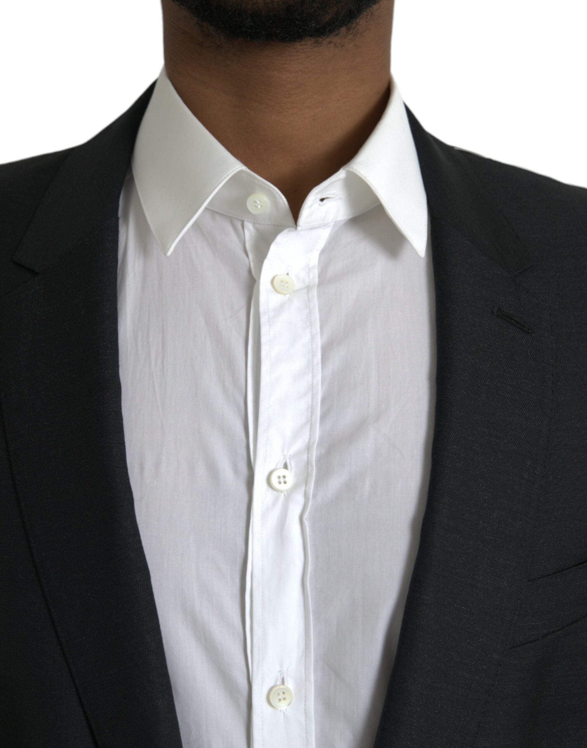 Manteau blazer Dolce & Gabbana en laine noire à col en V et fermeture simple, style élégant et sophistiqué.