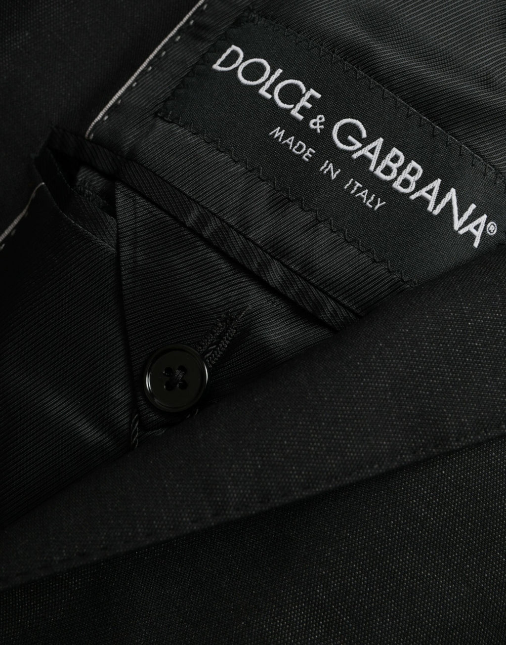 Manteau blazer noir en laine Dolce & Gabbana, coupe à col cranté, à un bouton, style élégant et classique.