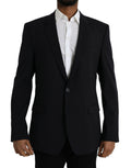 Manteau blazer noir Dolce & Gabbana Martini à coupe simple, élégance moderne, détails en tissu de qualité visible sur l'image.