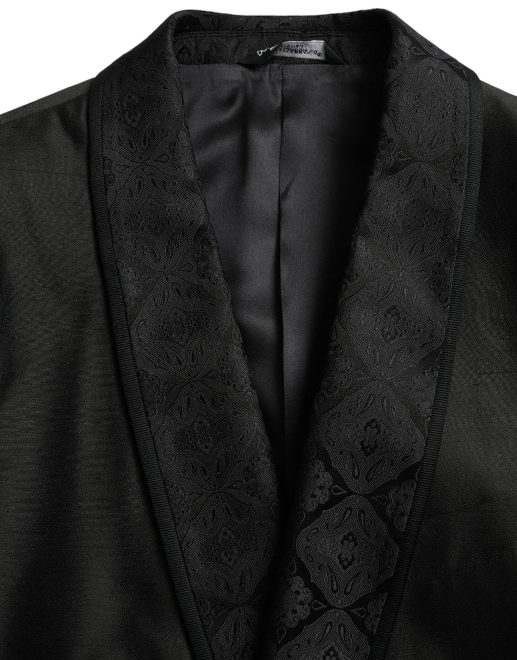 Manteau blazer noir Dolce & Gabbana MARTINI à coupe simple, élégant, en tissu chic, porté sur un mannequin.