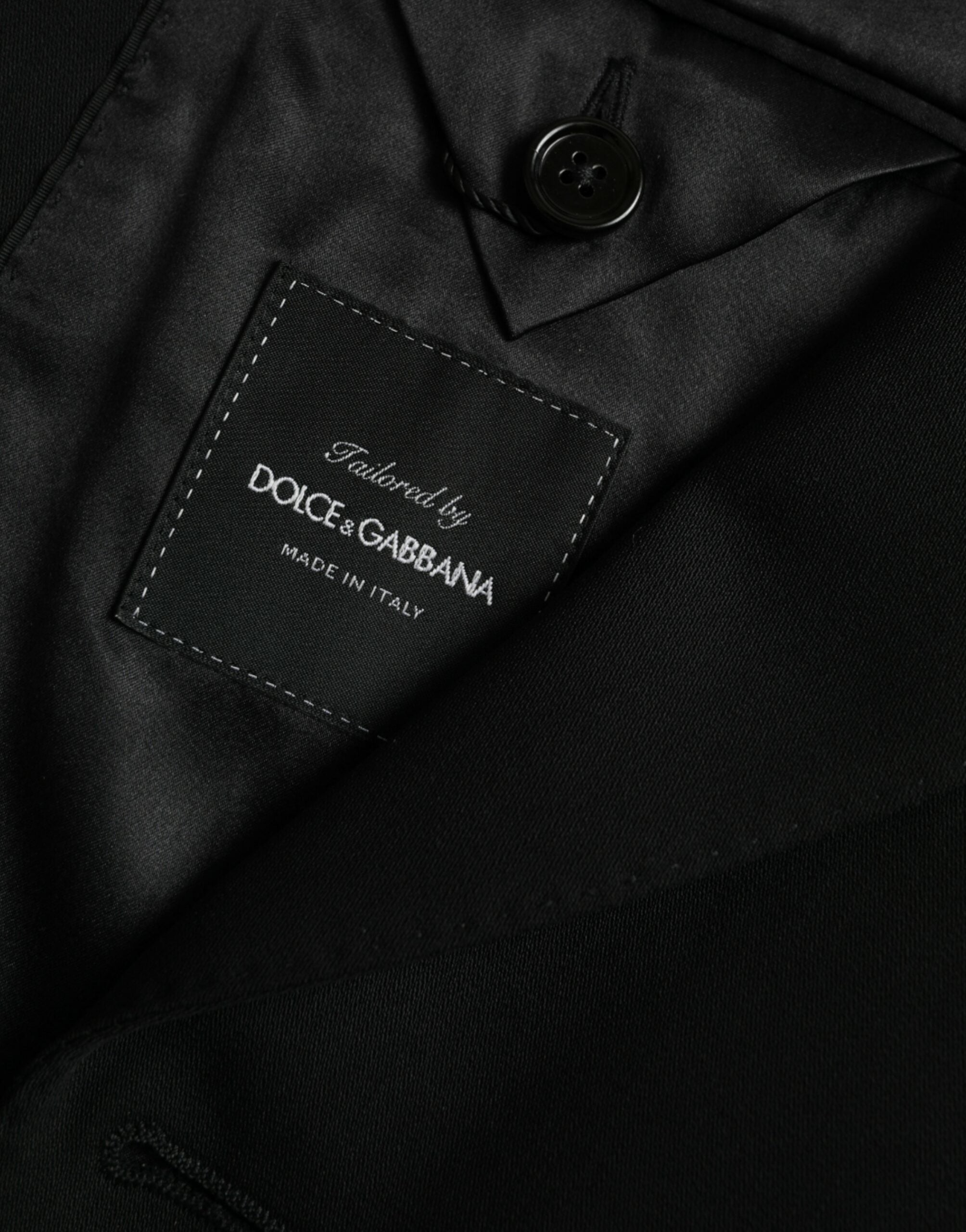 Manteau blazer noir en laine à col pointu, coupe simple boutonnage, de la marque Dolce & Gabbana, vue de face.