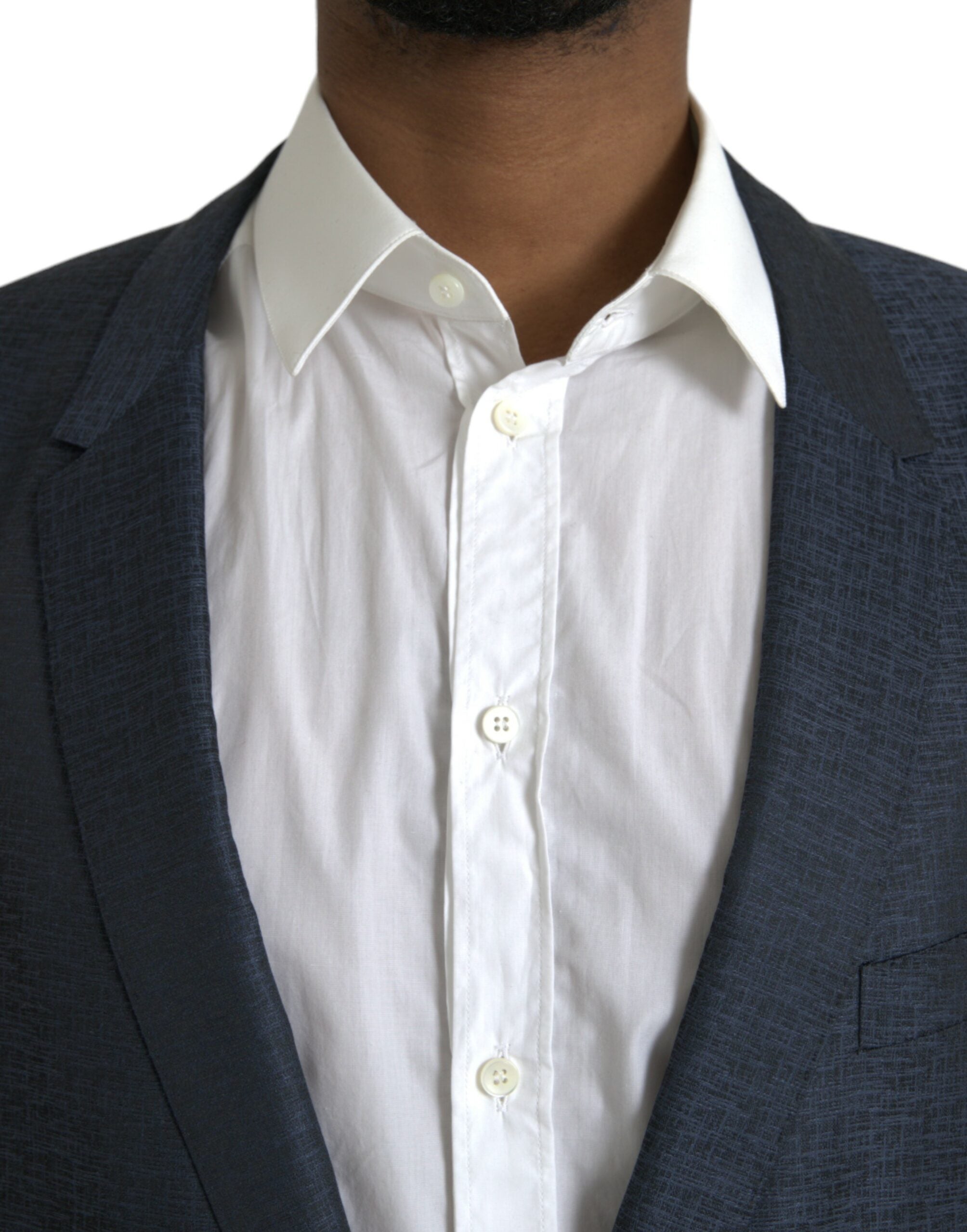 Manteau blazer bleu en laine Dolce & Gabbana à un bouton, coupe croisée, avec détails dorés, porté sur un mannequin.