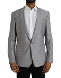 Manteau gris en laine Dolce & Gabbana, blazer à col pointu et coupe classique, vue de face sur fond neutre.