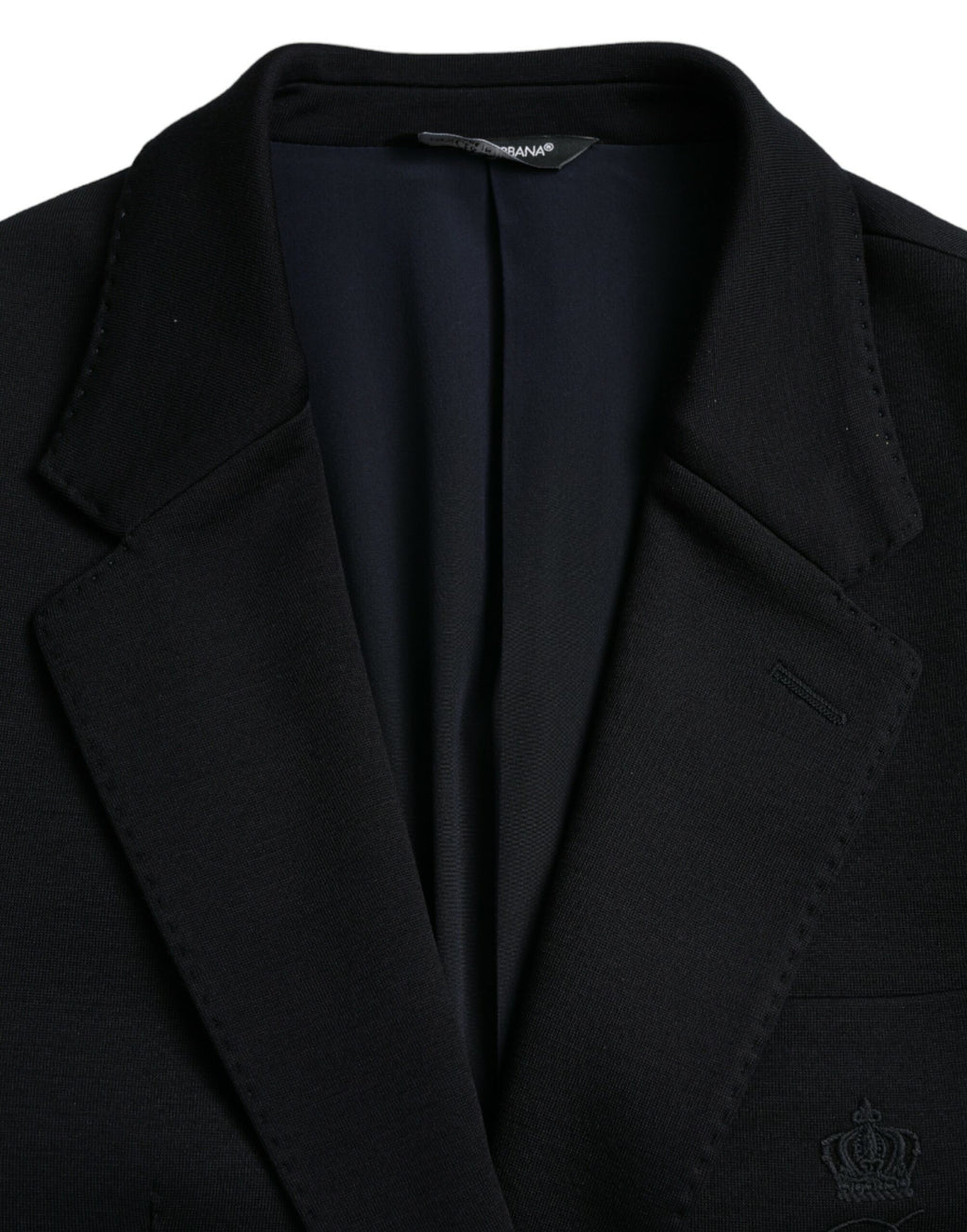 Manteau blazer en laine noire Dolce & Gabbana à col à notch, style classique et coupe élégante, porté en image.