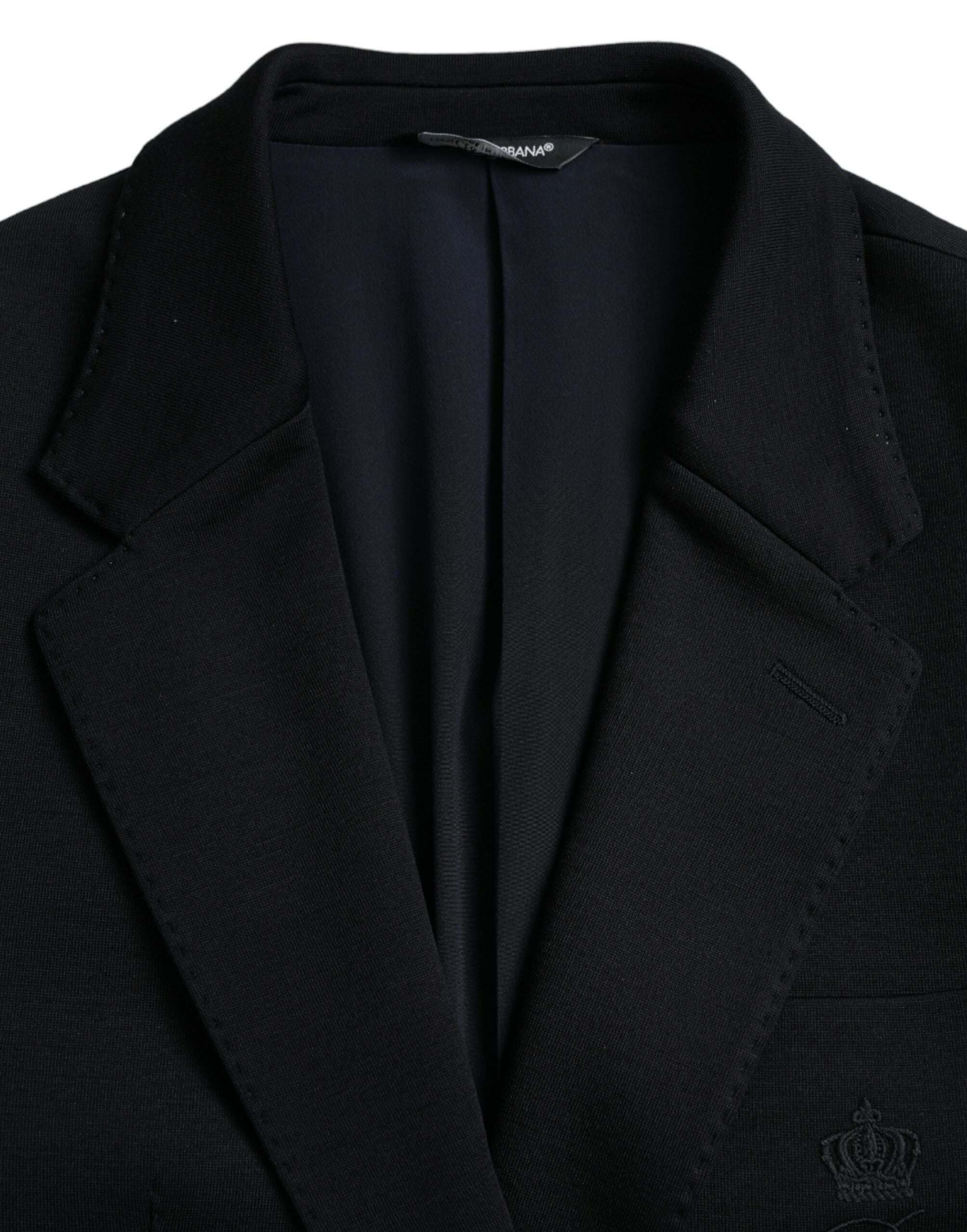 Manteau blazer en laine noire Dolce & Gabbana à col à notch, style classique et coupe élégante, porté en image.