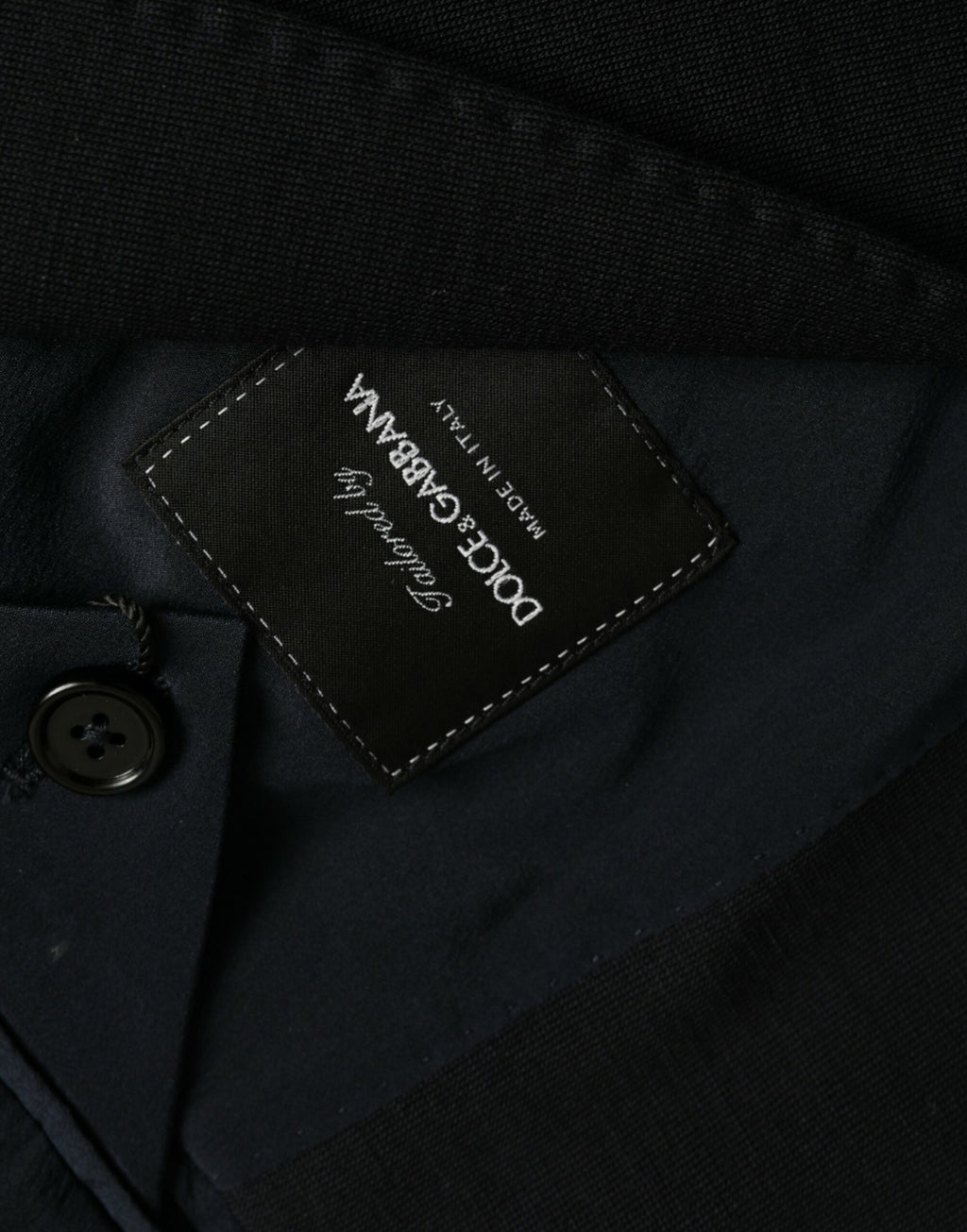 Manteau blazer noir en laine à revers en pointe, coupe simple boutonnage simple de Dolce & Gabbana.