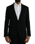 Manteau blazer en laine noire à revers à un bouton de Dolce & Gabbana, coupe classique et élégante, porté sur un mannequin.