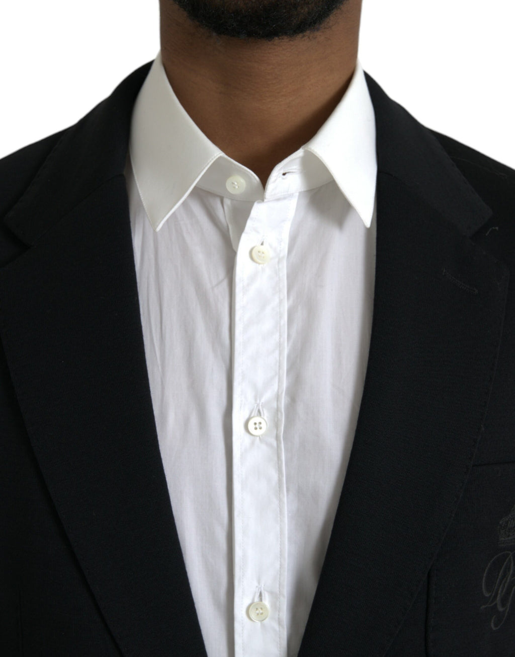 Manteau blazer noir en laine Dolce & Gabbana à col à revers simple, élégant et classique, porté sur un mannequin.