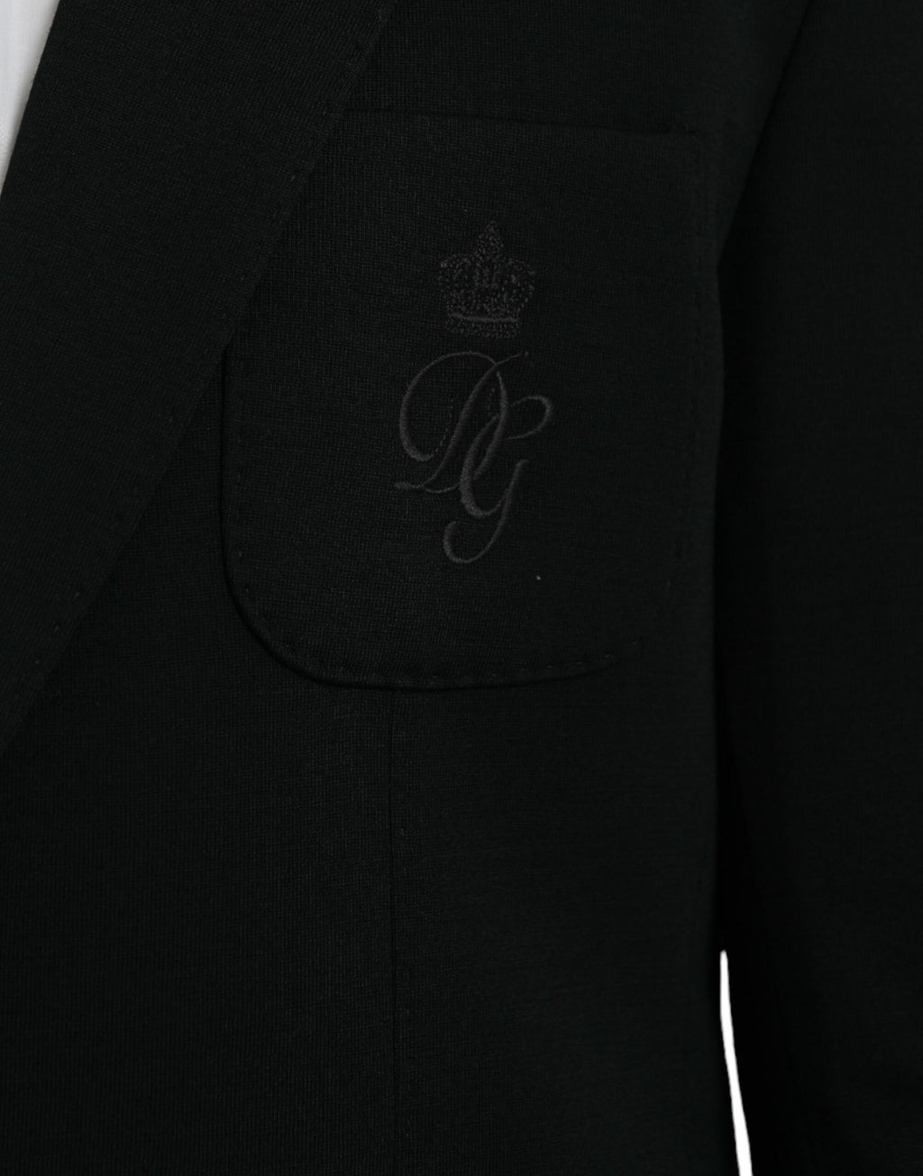 Manteau blazer noir en laine Dolce & Gabbana, à col cranté, à simple boutonnage, vue de face.