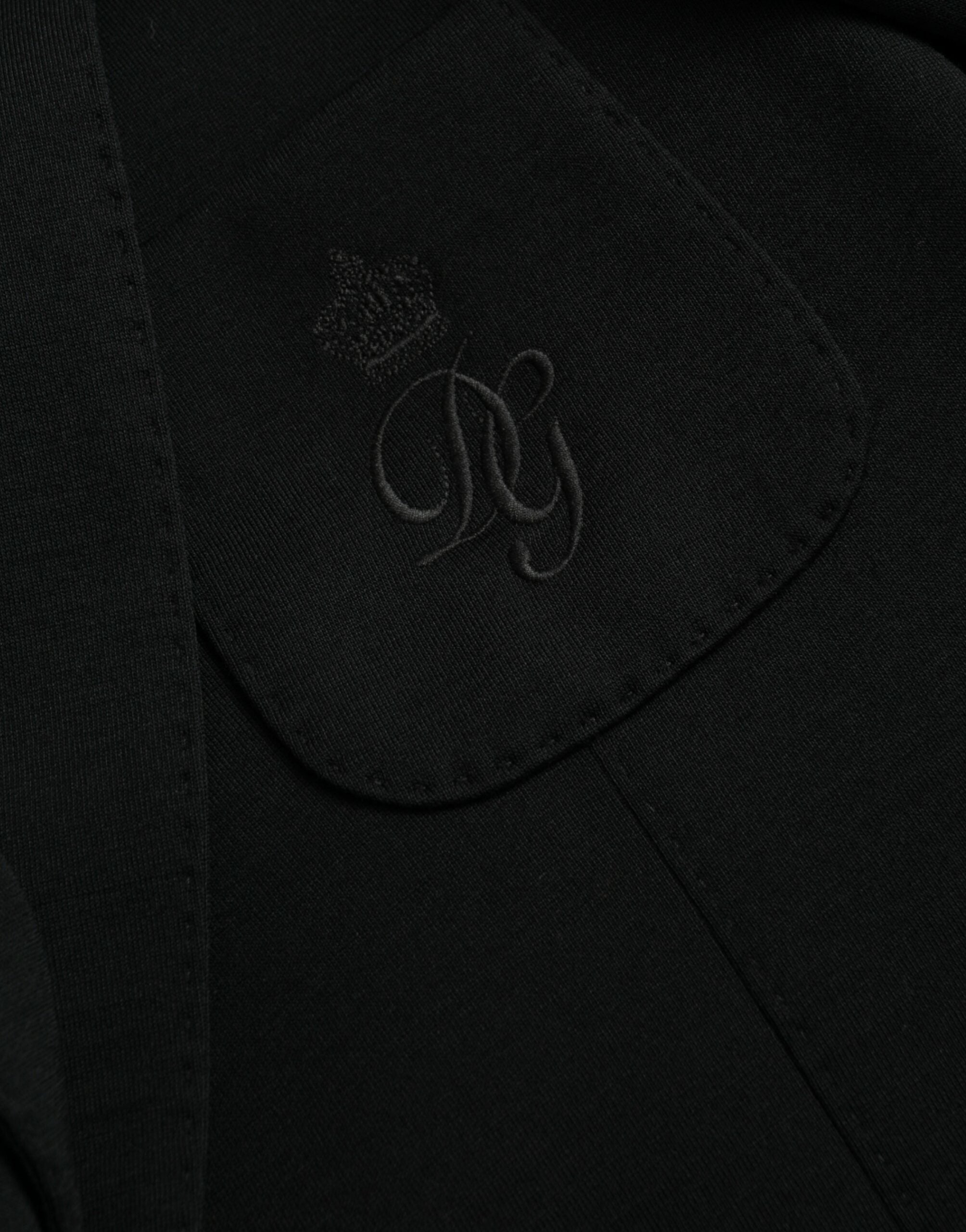 Manteau blazer noir en laine Dolce & Gabbana à col en V et fermeture croisée, style classique et élégant.