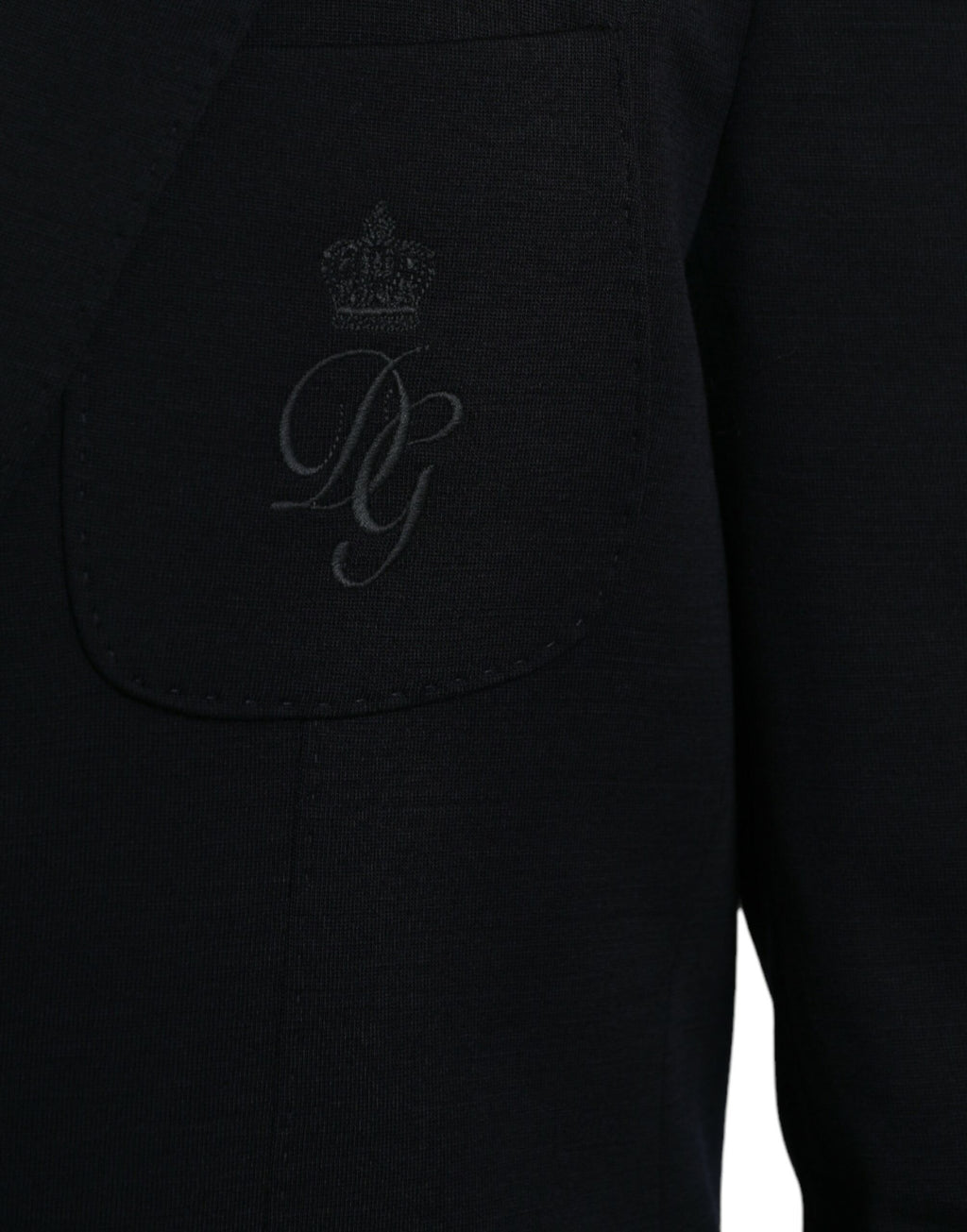 Manteau blazer en laine noire Dolce & Gabbana, coupe simple boutonnage simple, détails élégants, porté sur un mannequin.