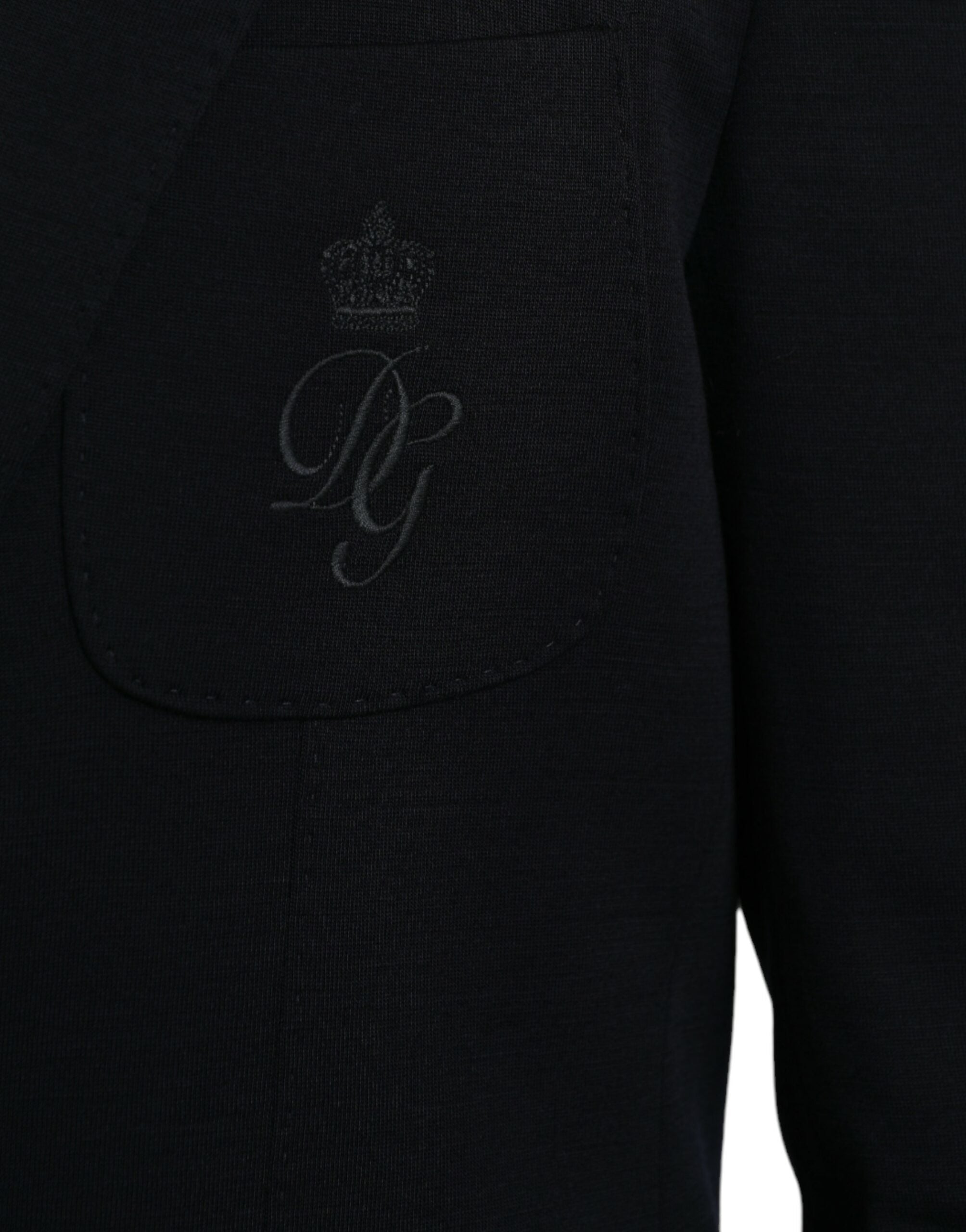 Manteau blazer en laine noire Dolce & Gabbana, coupe simple boutonnage simple, détails élégants, porté sur un mannequin.