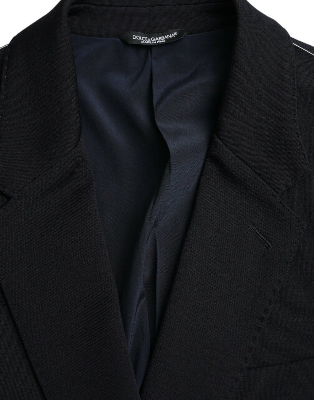 Manteau blazer noir en laine à un seul boutonnage de Dolce & Gabbana, coupe élégante et classique, porté sur un mannequin.