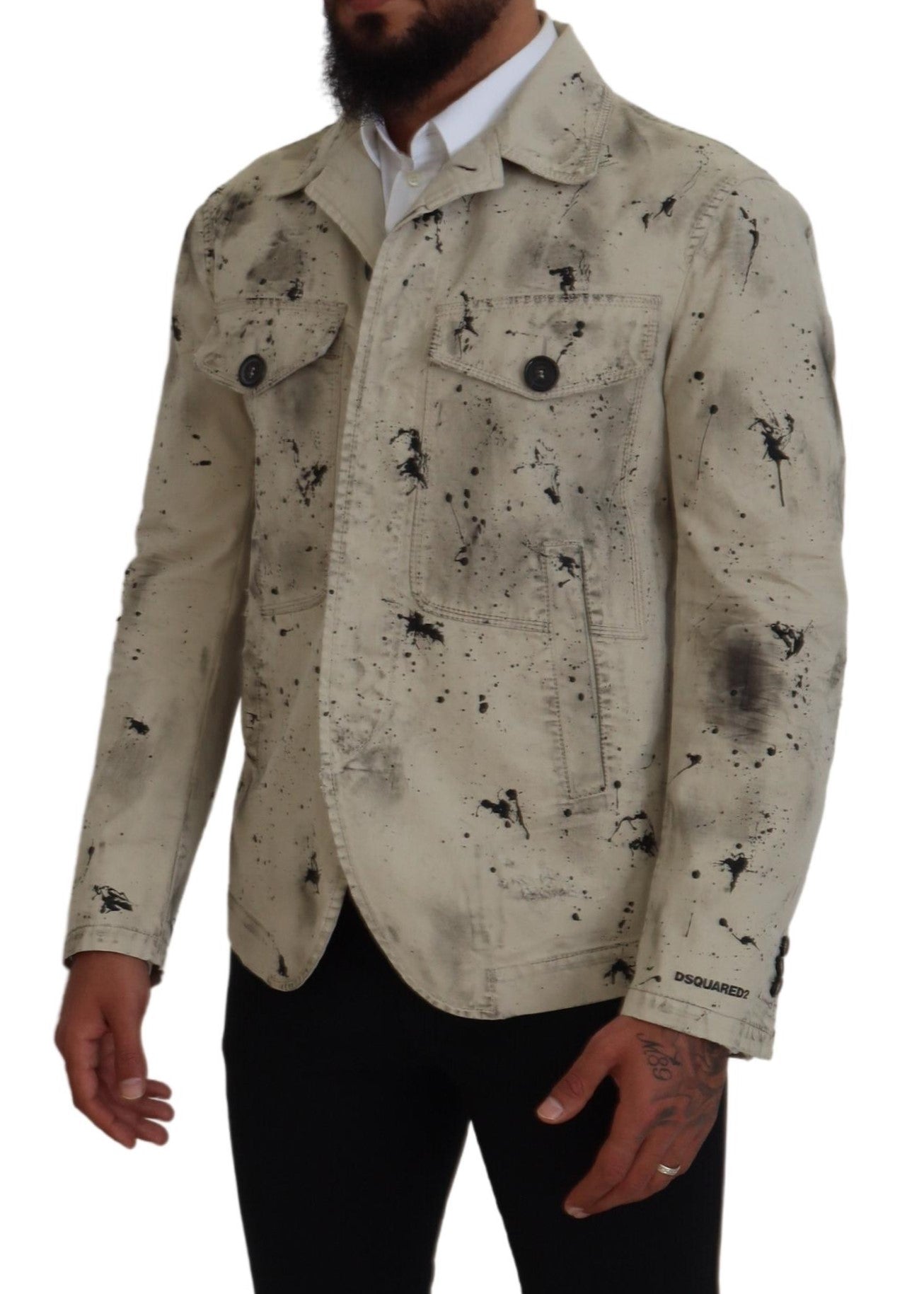 Veste en jean décontractée Dsquared² à éclaboussures noires et blanches, style casual, denim bleu avec détails colorés.