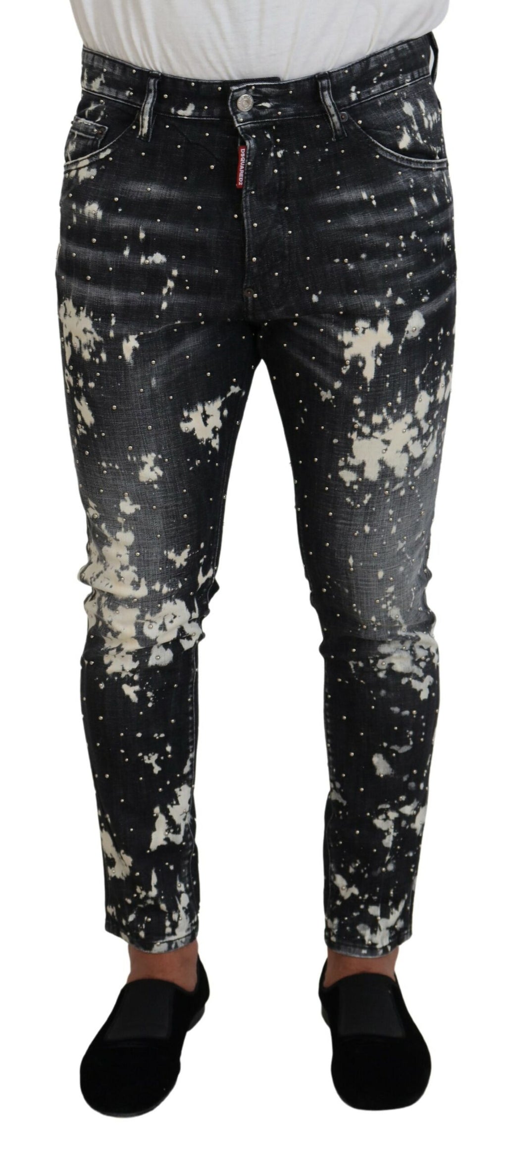 Jeans skinny en denim gris avec éclaboussures blanches de la marque Dsquared², visibles en détail sur le produit.