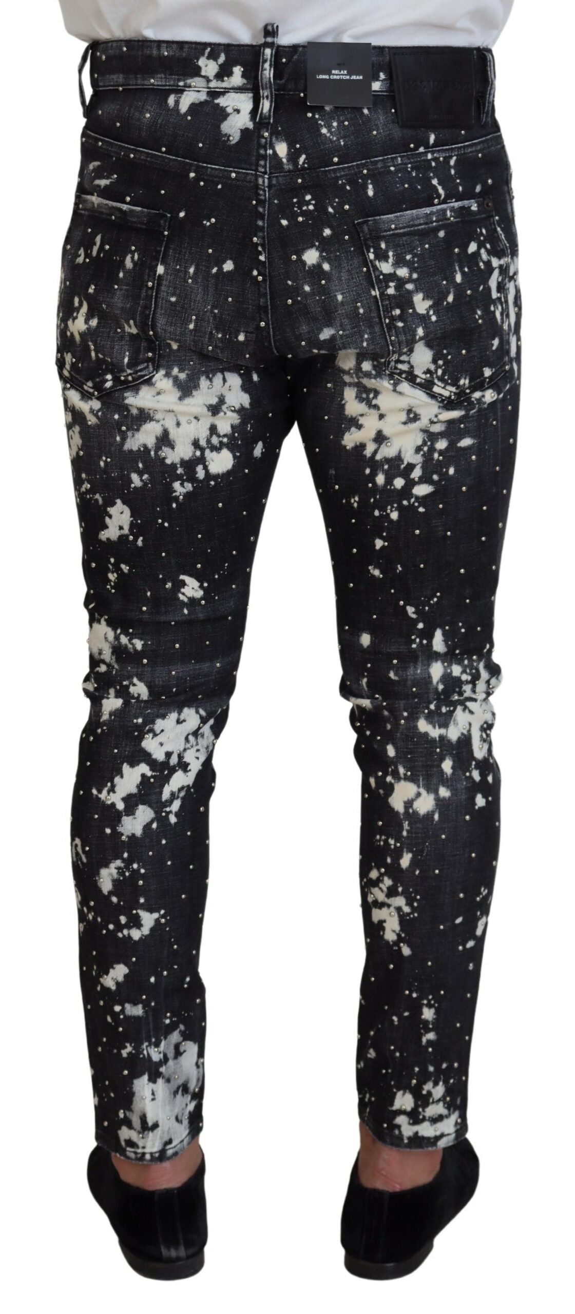 Jeans skinny en denim gris et blanc à éclaboussures, de la marque Dsquared², avec détails tendance et coupe ajustée.