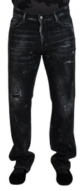 Jeans en denim déchiré noir de Dsquared² ornés de cristaux brillants et détails usés, style streetwear élégant.