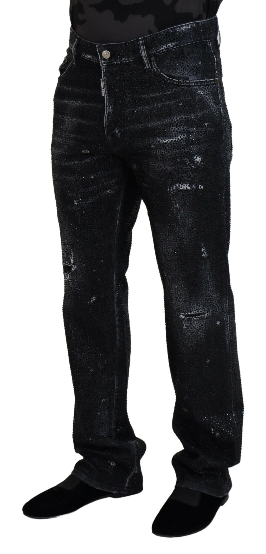 Jeans déchirés en denim noir avec cristaux scintillants de Dsquared², style tendance et détails usés visibles.