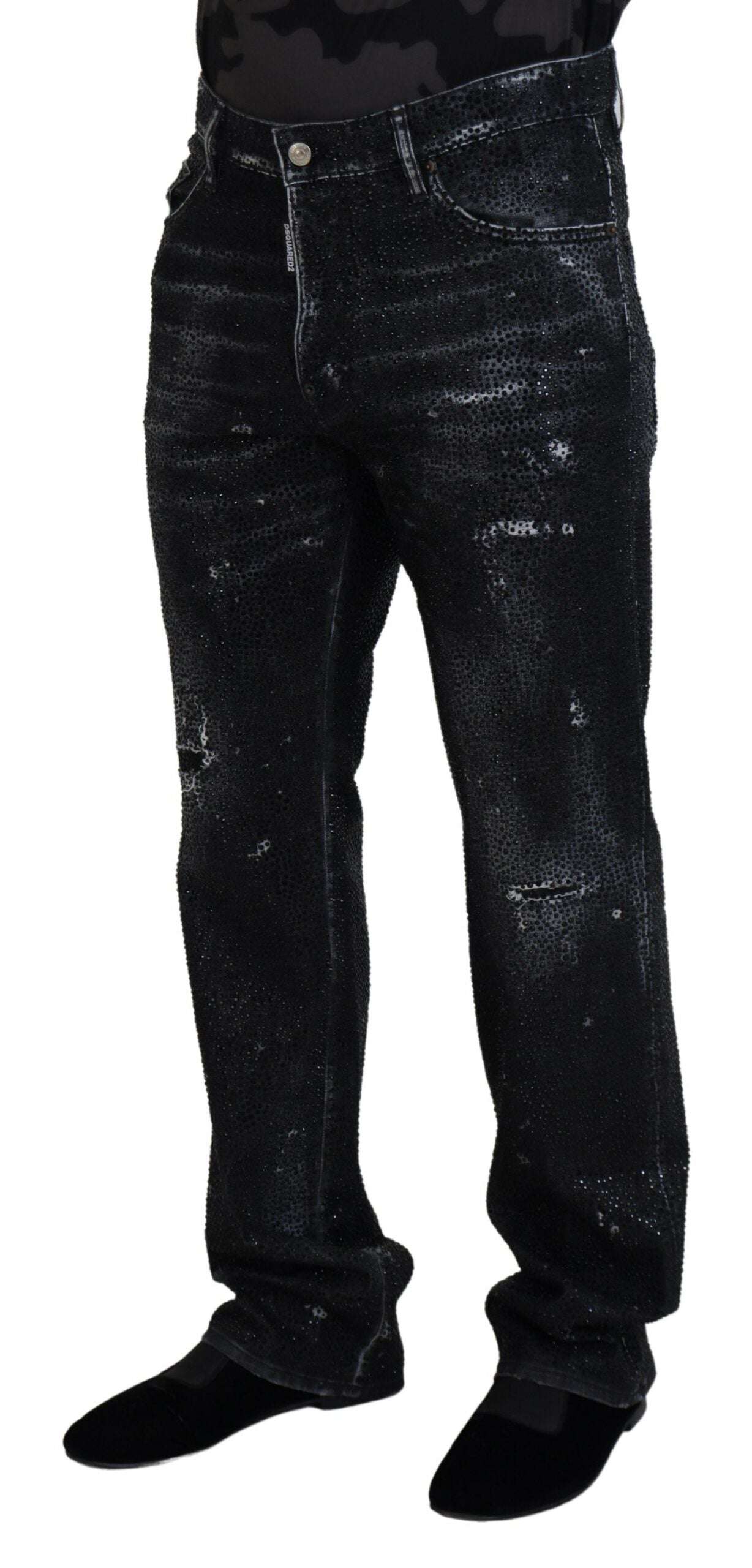 Jeans déchirés en denim noir avec cristaux scintillants de Dsquared², style tendance et détails usés visibles.
