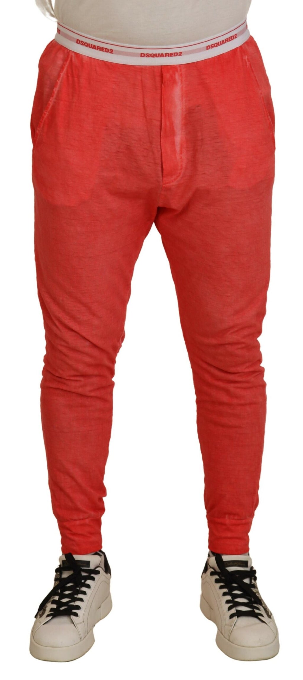 Pantalon homme en coton orange avec taille élastique et logo Dsquared², style décontracté et confortable.