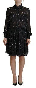 Robe à manches longues à pois noirs de Dsquared², boutons sur le devant, tissu fluide et élégant.