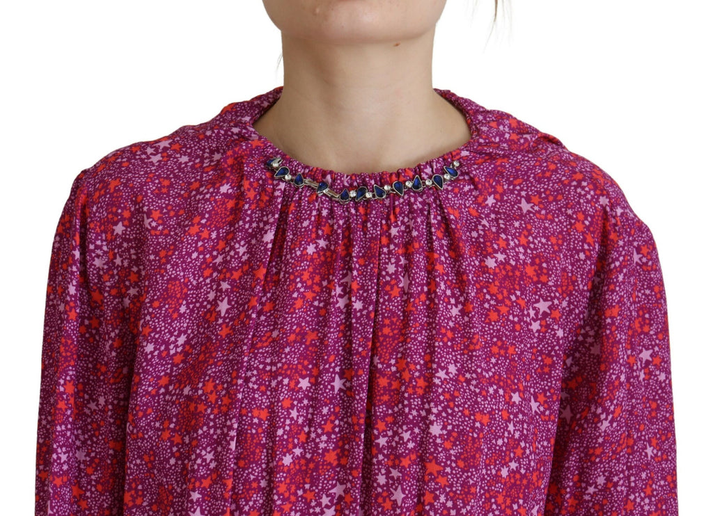 Robe longue à manches longues Dsquared² avec étoiles fuchsia brillantes et embellissements pour un look élégant et coloré.