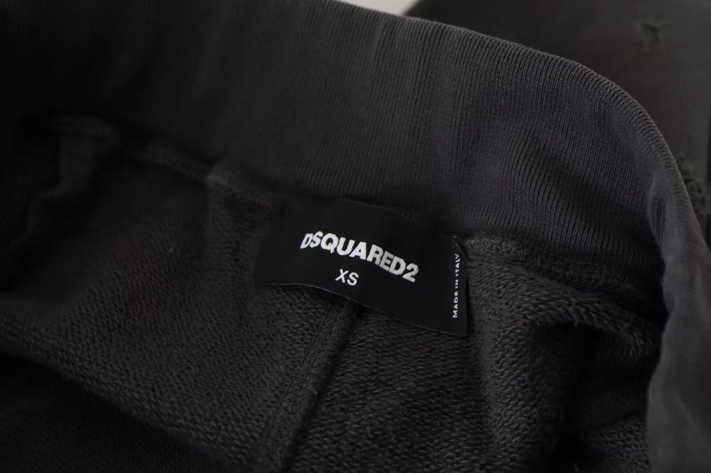 Shorts tachetés en coton noir Dsquared², taille mi-hauteur, coupe tapered, avec déchirures pour un style décontracté.