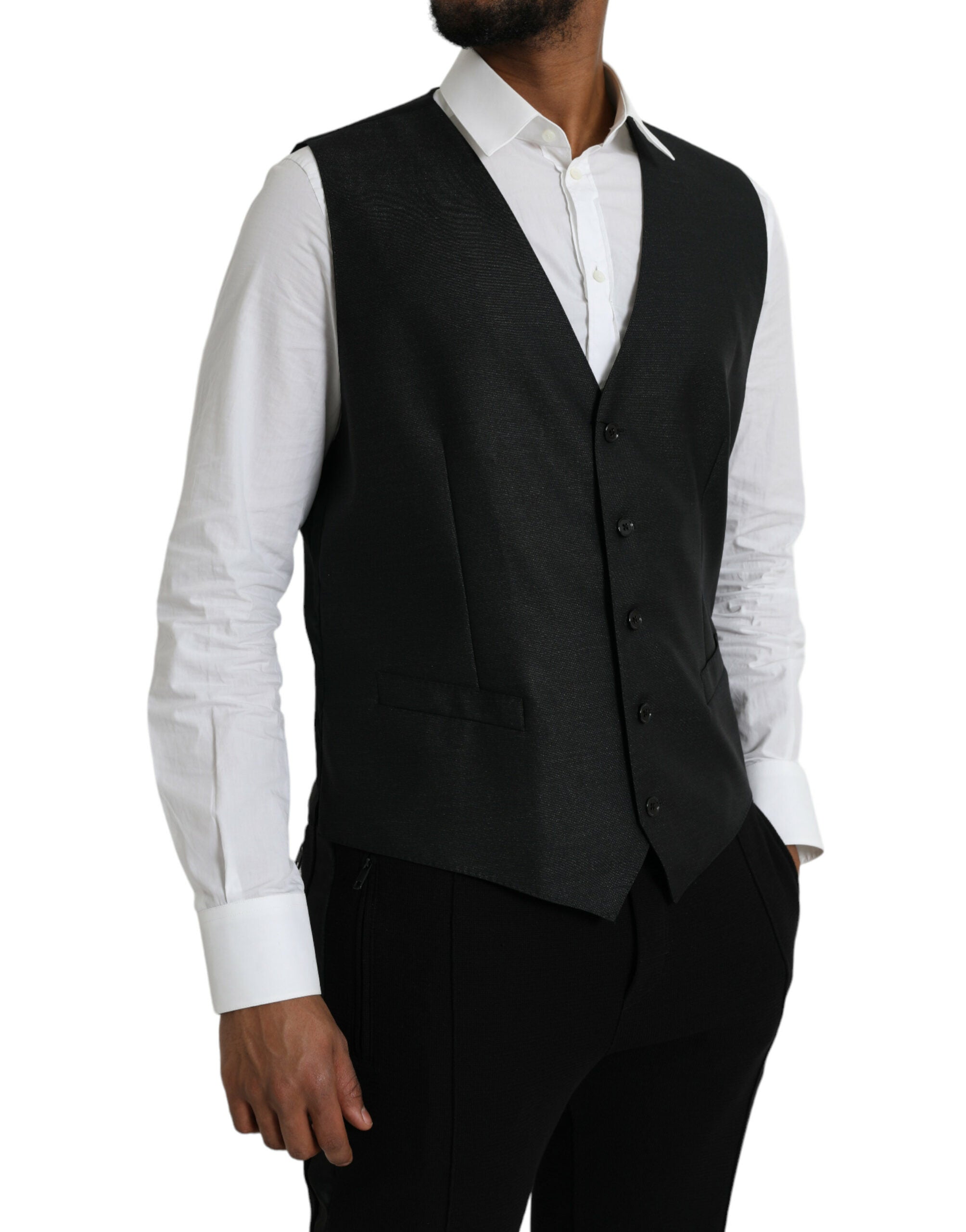 Gilet de costume noir en laine Dolce & Gabbana, vêtement formel, porté sur un mannequin, détails élégants et coupe ajustée.