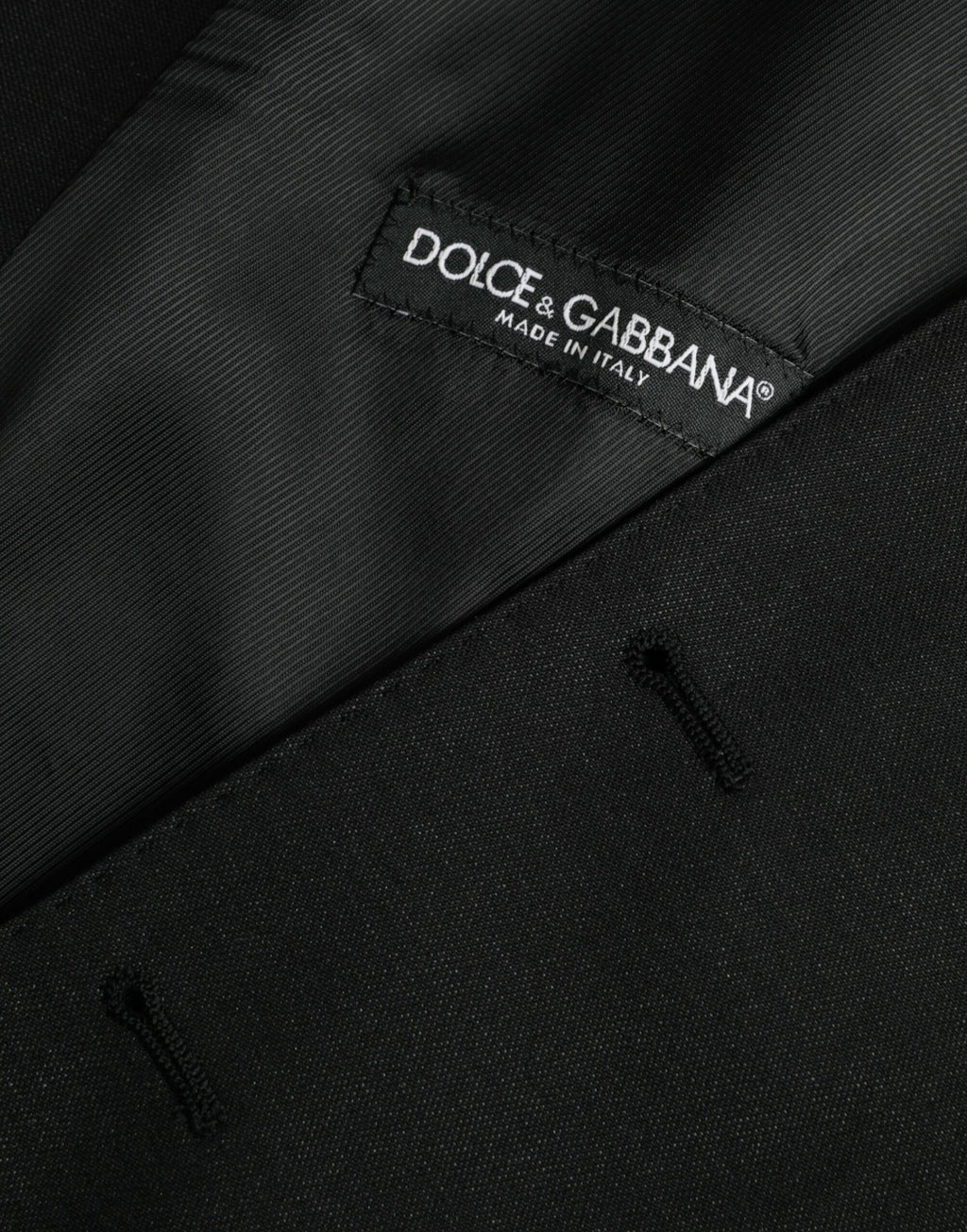 Gilet noir en laine Dolce & Gabbana, robe-veste formelle élégante, détail sophistiqué et coupe ajustée.