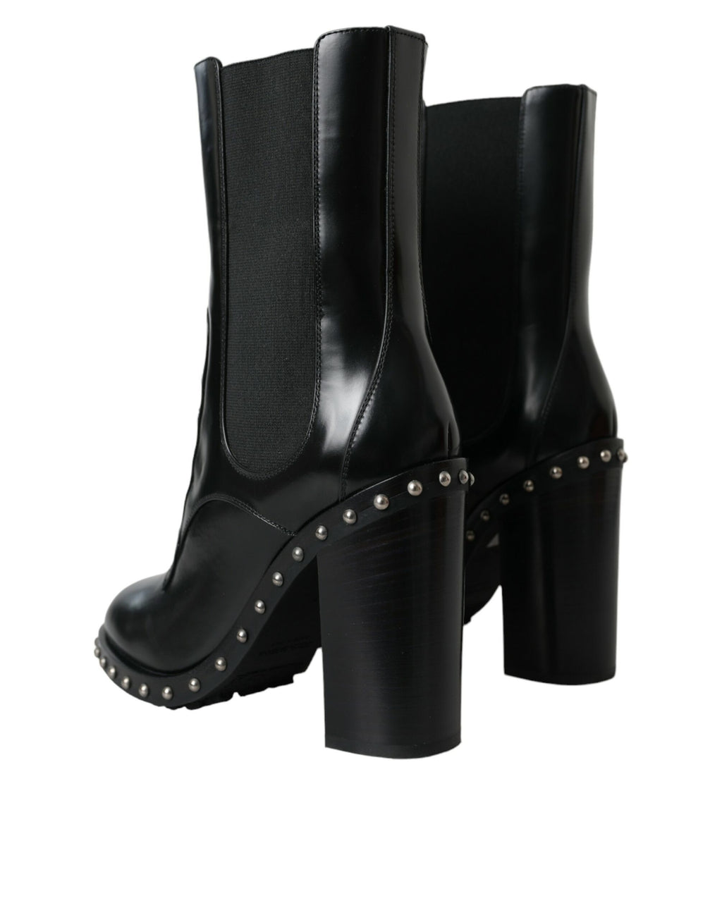 Bottes noires en cuir Dolce & Gabbana avec clous, lacets et talons, style élégant et sophistiqué.