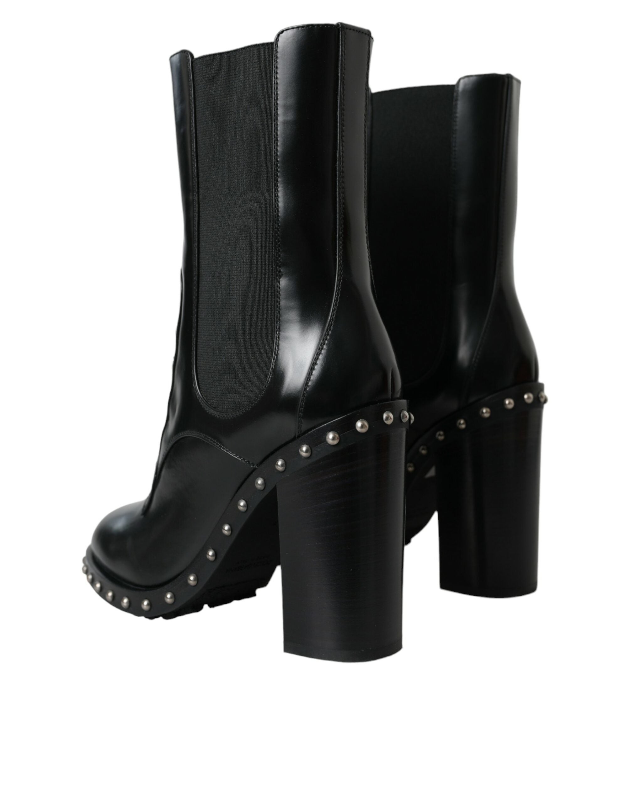 Bottes noires en cuir Dolce & Gabbana avec clous, lacets et talons, style élégant et sophistiqué.