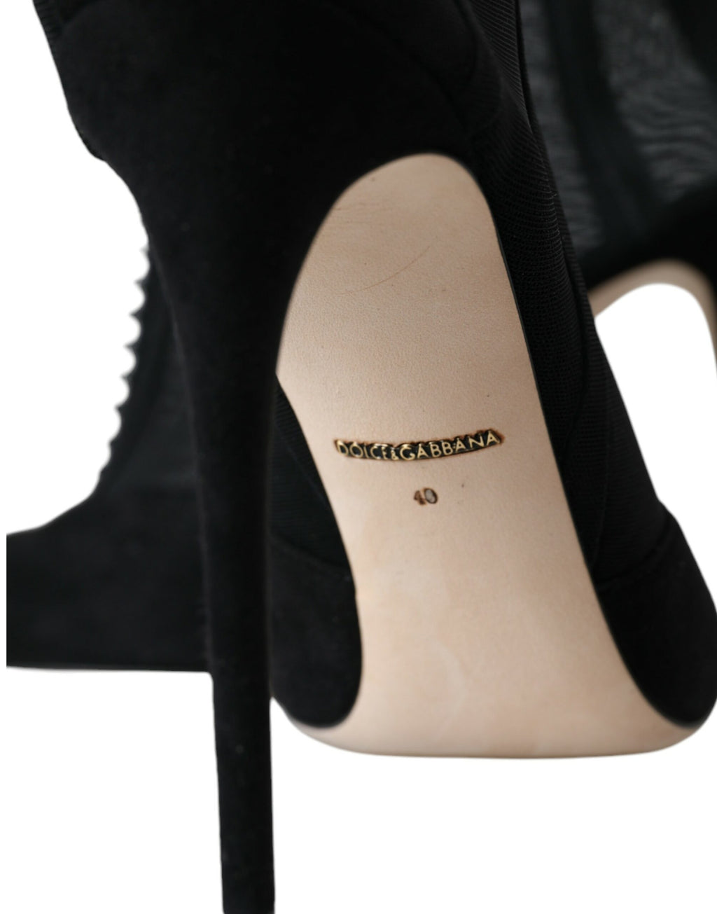 Escarpins à talons aiguilles en mesh noir de Dolce & Gabbana, bottines élégantes avec fermeture à laçets et semelle en cuir.