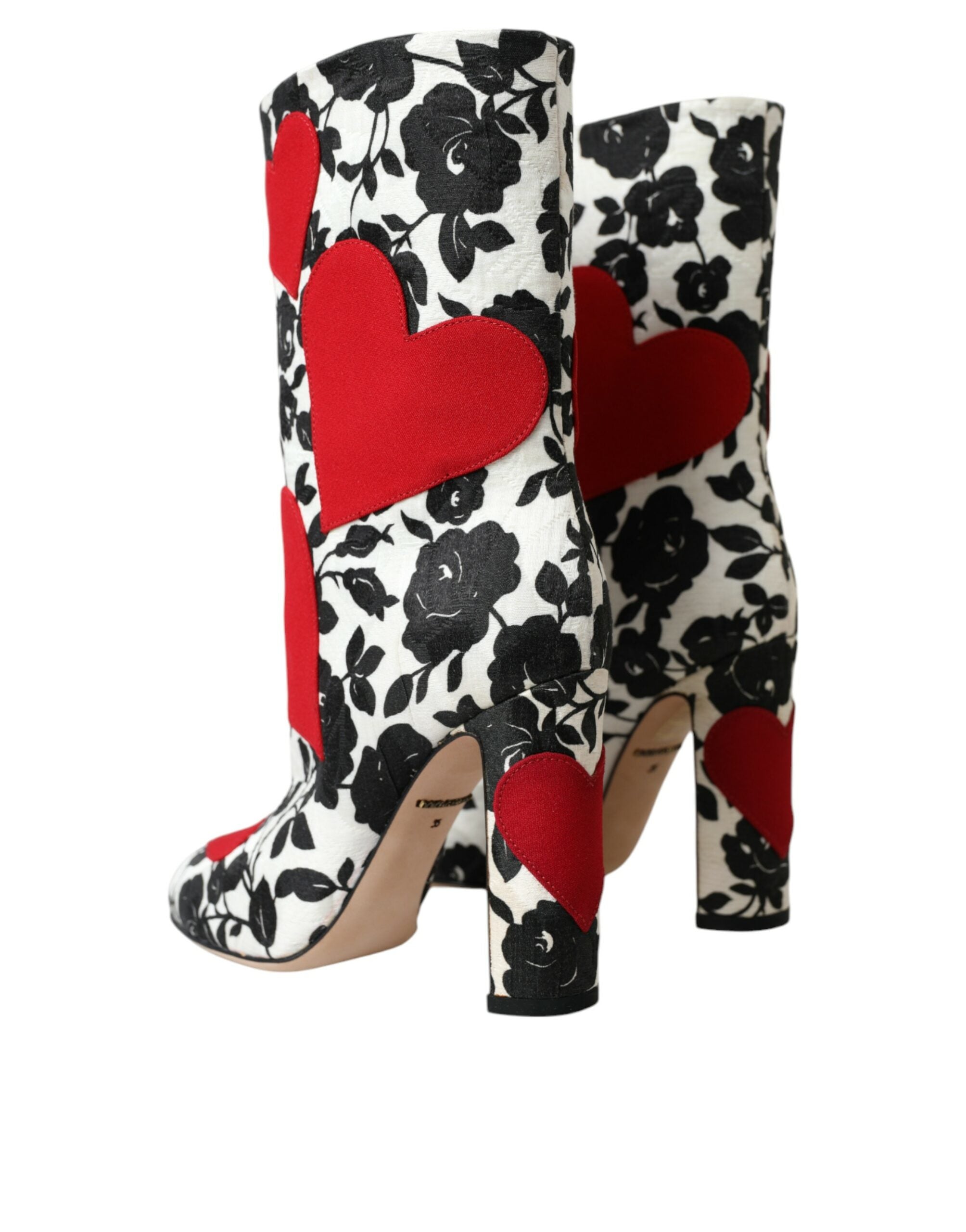Bottes en cuir blanches Dolce & Gabbana avec motifs de cœurs floraux et détails élégants.