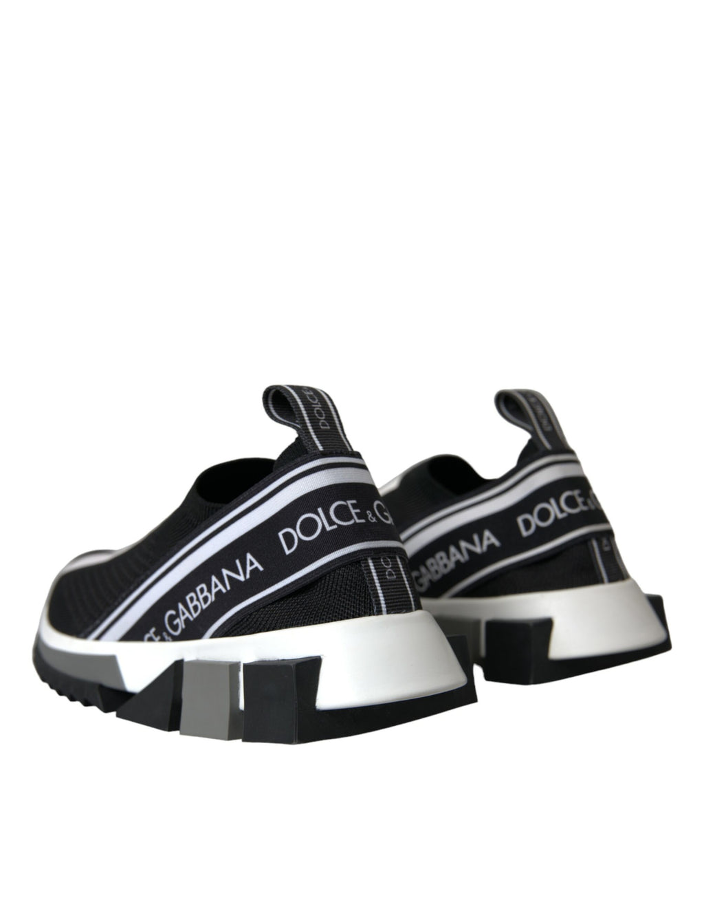 Chaussures Dolce & Gabbana slip-on Sorrento noires et blanches, baskets élégantes en cuir avec logo sur le côté.