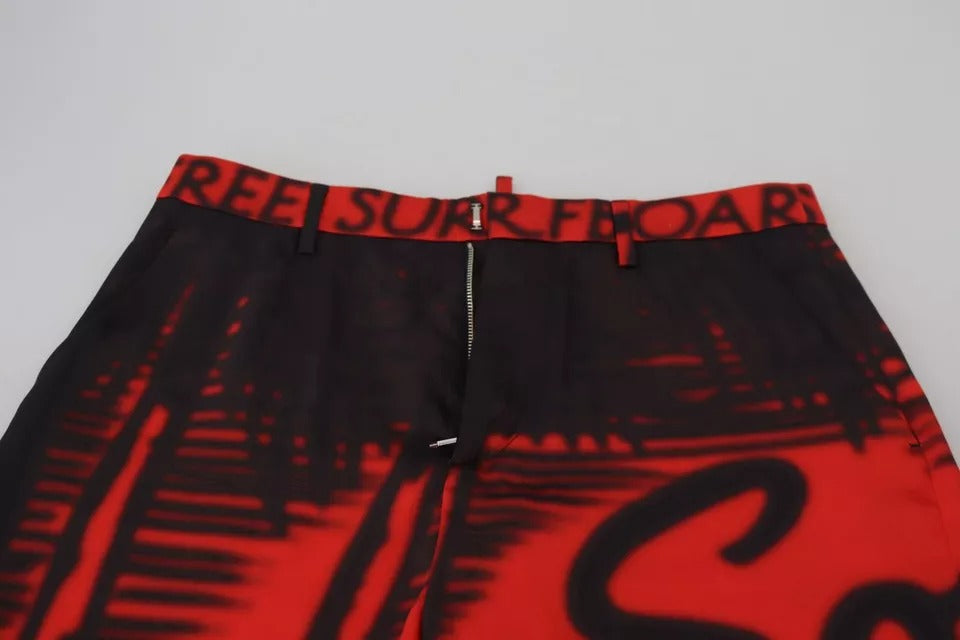 Pantalons droits à taille haute rouges imprimés Dsquared², en coton, avec motif floral visible sur l'image.
