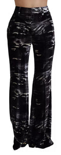 Pantalons super flare à taille haute en noir avec imprimé signé Dsquared², vue de face sur un fond neutre.