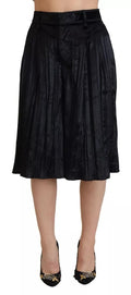 Pantalons cropped à taille haute plissés et à jambes larges noirs de Dsquared², visibles dans l'image.