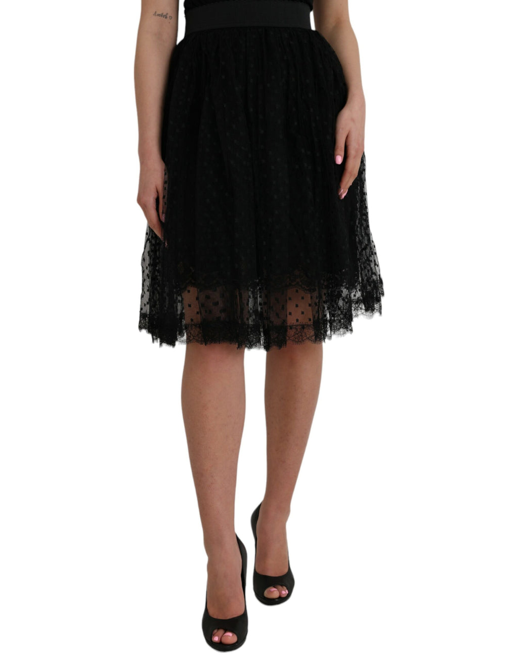 Jupe en nylon noire Dolce & Gabbana à taille haute, coupe évasée avec bordure en dentelle, vue de face.