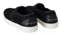 Chaussures Dolce & Gabbana en cuir noir avec dentelle, logo plat, slip-on, sneakers élégants pour femmes.